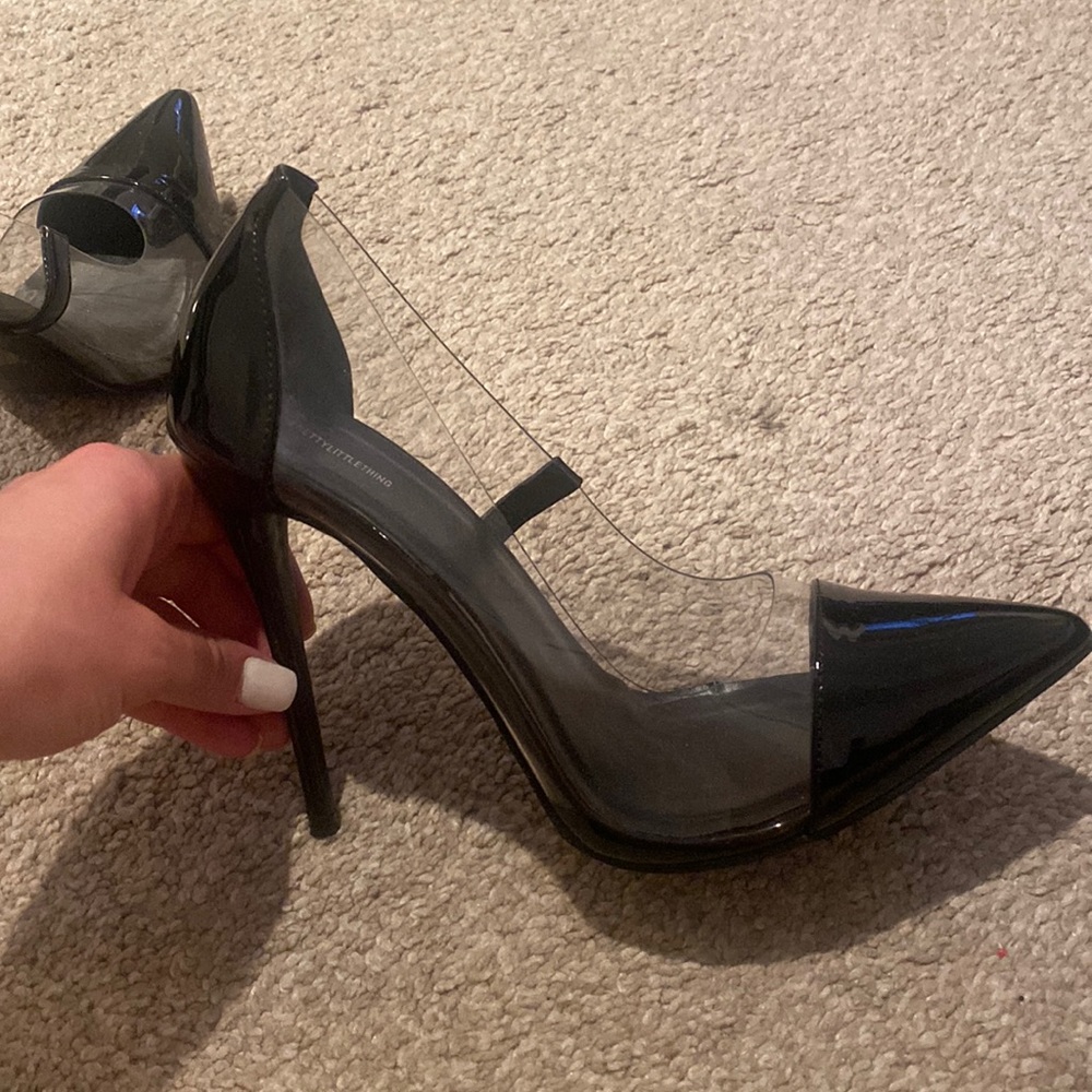 New, never worn heels. Black with clear